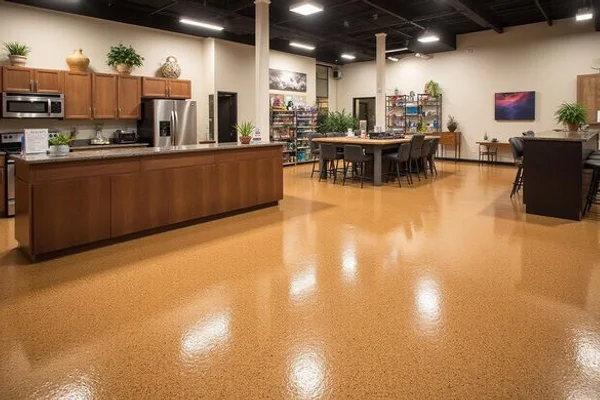 Commercial epoxy floor coating in an Austin retail showroom with quartz broadcast surface and professional finish