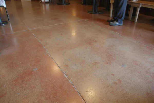 Farm-to-table restaurant near South Congress Austin with sealed acid-stained concrete floor in rich earthy tones
