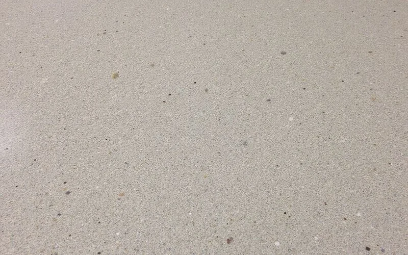 Salt-and-pepper aggregate polished concrete floor installed by Austin Concrete Finishes at a commercial building